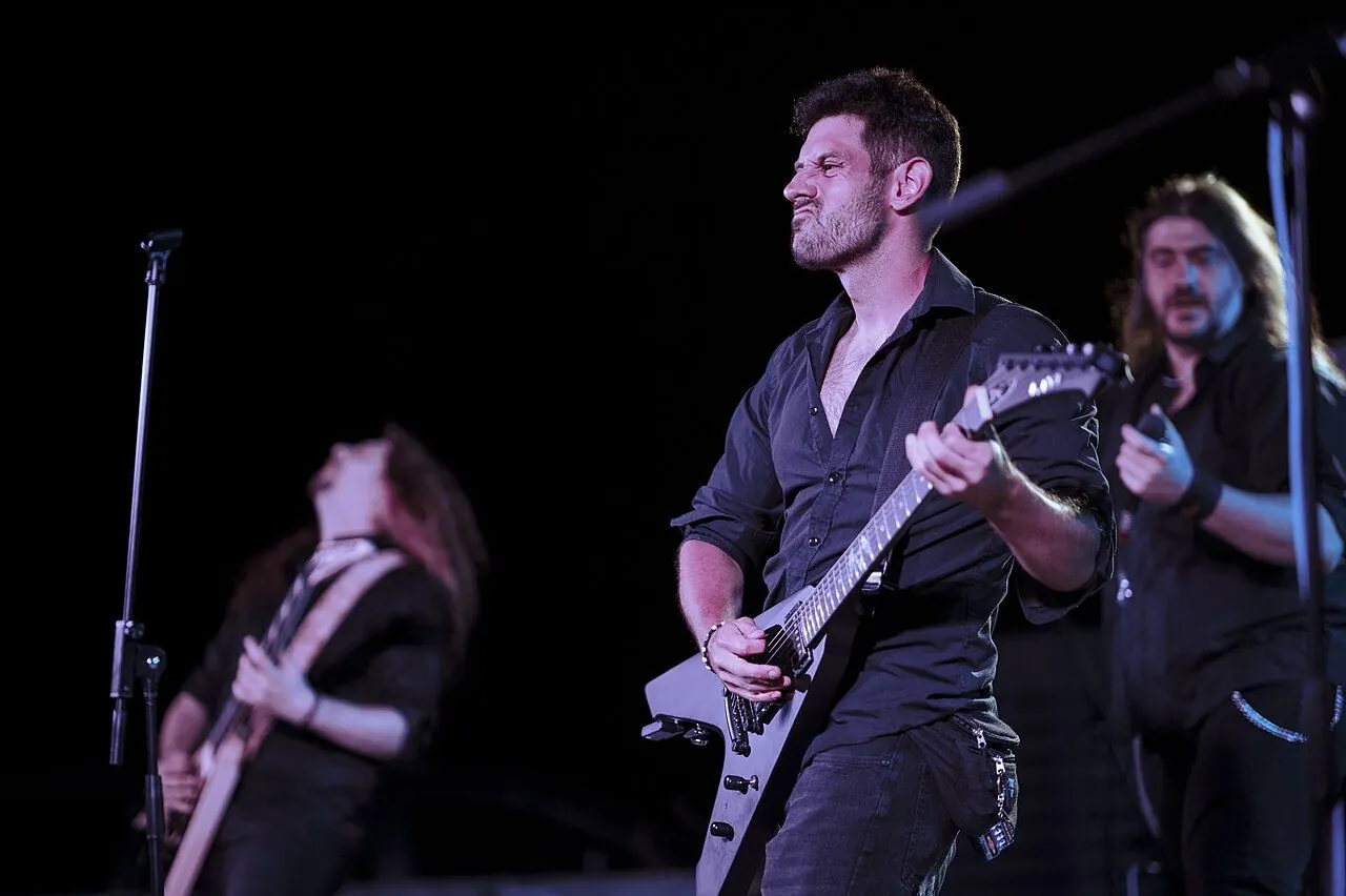 Band performing under stage lights at a gig